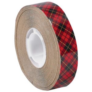 The 3/4 x 18 yds. roll of 3M™ 926 Adhesive Transfer Tape, recognizable by its red and black plaid pattern with thin yellow lines, is part of a pack of six and features a white plastic core.