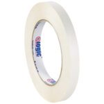 A 1/2 x 60 yds. Tape Logic® Double Sided Film Tape roll is shown at an angle, featuring inner branding in blue and red. The fresh edge signals its unused, with a standard texture for general purposes. (96 Rolls/Case).