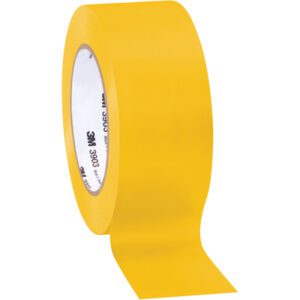 A roll of 2 x 50 yds. yellow adhesive tape is partially unrolled, showing a smooth surface and label inside the cardboard core with brand details. This is the 2 x 50 yds. Yellow (3 Pack) 3M Vinyl Duct Tape 3903, conveniently packed as three per case for easy storage and use.
