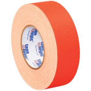 The 2 x 50 yds. Fluorescent Orange Tape Logic® 11 Mil Gaffers Tape from the (3 Pack) set stands upright, displaying its wide side and inner cardboard spool with the tape logic logo on the white center.