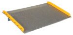 The Vestil Aluminum Dock Board Steel Curb 10K 72X48, with a textured surface and bright yellow side bumpers, is designed to bridge gaps and facilitate material transfers between levels. It features a durable steel curb and can support up to 10,000 lbs with a slight angle for seamless movement.