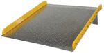 The Vestil Aluminum Dock Board Steel Curb 10K 72X72 includes a metal loading ramp with sturdy yellow safety rails on both sides and a textured, slightly elevated surface for gripping, facilitating the easy movement of heavy equipment or vehicles.
