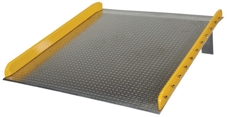 TAS-10-7272_A.jpg The Vestil Aluminum Dock Board Steel Curb 10K 72X72 includes a metal loading ramp with sturdy yellow safety rails on both sides and a textured, slightly elevated surface for gripping, facilitating the easy movement of heavy equipment or vehicles.