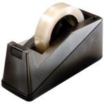 The 3M™ HB900 Table Top Dispenser, in sleek black, cradles a transparent tape roll. Its angled design and sharp blade make unwinding the tape easy and ready for any task.