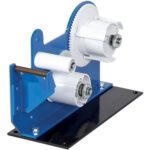 A blue and black industrial gear mechanism with white rollers on a base, resembling the MH-USA Double Sided Tape Dispenser, featuring large and small gears likely used for processing or manufacturing purposes.