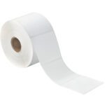 The MH-USA 3 x 2 White Desktop Direct Thermal Labels (735/Roll) partially unroll to show a few labels protruding, highlighting their practical design with a central cardboard core.