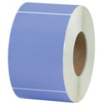 An upright roll of MH-USA 4 x 6 Purple Thermal Transfer Labels (1000/Roll) with a white-bordered label against a plain background showcases its round shape and central hollow cardboard core.
