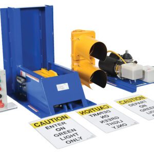 A blue vehicle restraint system and Vestil Electric Hydraulic W/Aluminum Light Pkg are included in the industrial loading dock equipment, along with a control panel. Clear visibility is ensured by a yellow dock light set, while safety is enhanced by prominently displayed caution signs.