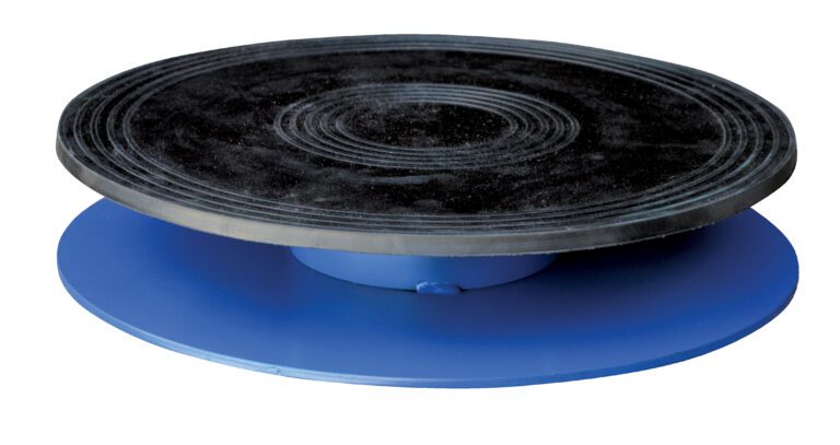 TT-18-4_A.jpg The Vestil Turntable, featuring an 18-inch diameter and a 3.437-inch height, comes in blue with a black concentric circle-marked platform, offering an elegant rotating display for objects or art, supporting up to 0.5K weight effortlessly.
