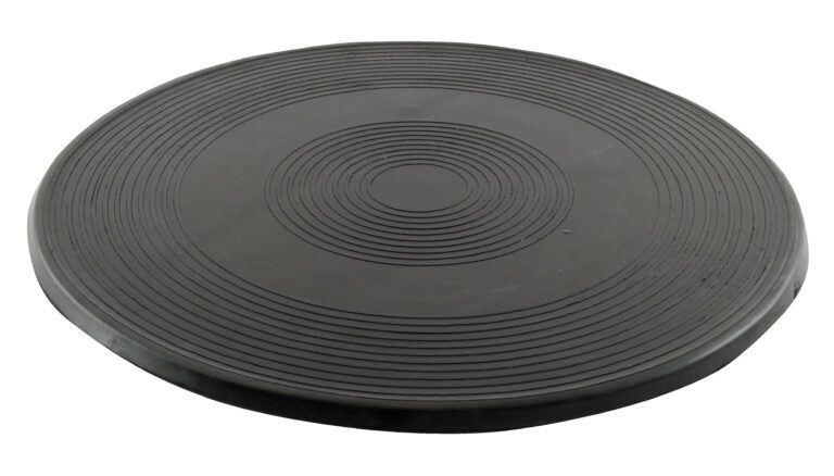 The Vestil Turntable measures 18 inches in diameter and 13/16 inch in height, resembling a black circular balance board. It features concentric ridges ideal for exercise and stability training, supporting up to 1K user weight.