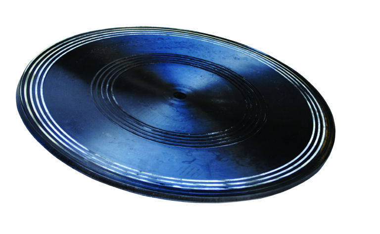 A dark blue or black vinyl record with multiple grooves and a central hole, ideal for the Vestil Turntable, 24 inches in diameter. Its light-reflecting surface highlights its circular shape against a white background, merging modern design with classic sound.