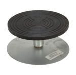 The Vestil Turntable 8 In Diameter 3.9375 In H 0.5K features a sleek metal design with a circular black rubber top, concentric circles, and supports up to 0.5K weight efficiently.