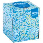 The Kleenex® Boutique® 2-Ply Facial Tissue box, part of a 36-pack case, features a blue and white leaf design with the Kleenex logo prominently displayed in white on a blue background, combining functionality with elegance.