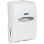 The Kimberly-Clark® C-Fold/Multi-Fold Hand Towel Dispenser in white features a wall-mounted design with an oval viewing window to check towel supply, sized at 13W x 19H x 6D for a blend of convenience and style.