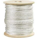A large spool of MH-USA 3/8, 2,900 lb white twisted polyester rope is wound around a wooden reel against a plain white background.