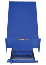 The blue industrial loading dock leveler, echoing the robust design of the Vestil Lift Table 2K 24X48 Blue 230V 3 Phase, includes a flat metal platform and safety labels, expertly crafted to bridge the gap between dock and truck for efficient loading and unloading.