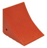 The Vestil Jumbo Urethane Wheel Chock 14.8X17.5X15 is orange, triangular, textured, and features a sloped front for wheel security plus a small side hole for easy handling.