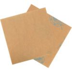 Two overlapping MH-USA 24 x 24 VCI Paper 30 lb. Sheets (500/Case) with a brown, coarse texture feature faint blue markings and numbers on one edge, resting against a white background to emphasize their rugged consistency.