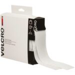 A 2 x 15 White VELCRO® Brand Tape from the Combo Packs features industrial-strength tape extending out of a predominantly white box adorned with black text and icons, highlighting its practical design.