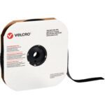 A 1 x 75 roll of black VELCRO® Brand Loop Tape, partially unwound, is housed in a labeled cardboard dispenser. The Velcro USA logo and contact info on the front highlight its quality as individual strips.