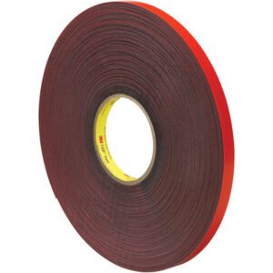 The 1/2 x 5 yds. Gray 3M™ 4611 VHB™ Tape, featuring a red liner and black adhesive, is ideal for construction or automotive bonding. The yellow-branded core holds a single roll per case.