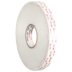 The 1/2 x 5 yds. White 3M™ 4930 VHB™ Tape (1 Roll/Case) features a clear center, red 3M logo, and double-sided adhesive, ideal for secure and easy item fastening.