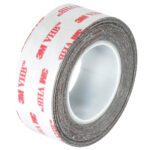 The 1 x 5 yds. White 3M™ 4932 VHB™ Tape features a white backing with red 3M branding, tightly wound to discreetly conceal its strong adhesive side within the case.