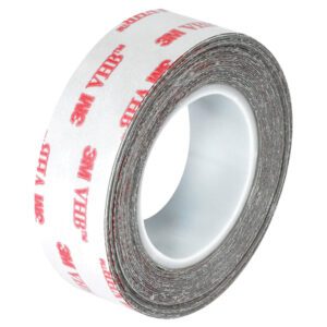 The 3/4 x 5 yds. White 3M™ 4932 VHB™ Tape (1 Roll/Case) showcases a white adhesive and the iconic red brand logo. This single roll features notable thickness and width, ideal for diverse bonding needs.