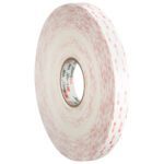 A large roll of thick, double-sided 1/2 x 5 yds. white 3M™ 4950 VHB™ tape with prominent red text and 3M branding on the surface is tightly wound, showcasing its impressive width and adhesive.