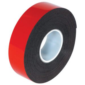 A 1 x 5 yds. roll of Dark Gray 3M™ 5952 VHB™ Tape comes with a shiny red liner, highlighting its superior adhesive surface and neat coil.