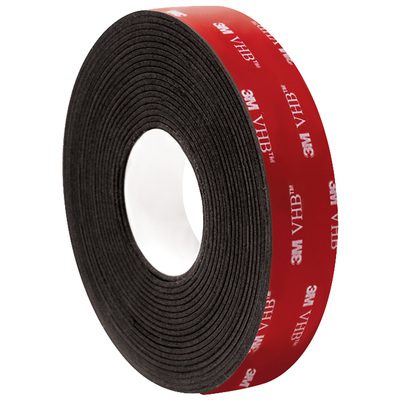 VHB596201R.jpg The 1 x 5 yds. Black 3M™ 5962 VHB™ Tape showcases a vivid red backing with 3M VHB branding, contrasting with its white inner core. This adhesive tape comes in a case containing one roll.