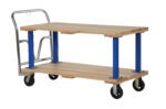 The Vestil Double Deck Hardwood Platform Cart 27X54 includes a robust wooden flatbed with a metal handle and four wheels, featuring durable wooden top and bottom shelves supported by elegant blue metal legs for both style and functionality.
