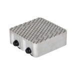 The Vestil Cast Aluminum Dolly 6000 Lb features a textured metal pad with a crisscross diamond pattern, two side knobs, and has an 8.5L X 8.5W rectangular shape with rounded edges, supporting up to 6000 lbs for industrial or mechanical use.
