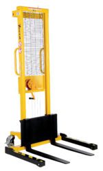 The Vestil Manual Hand Winch Adj Stacker 770 Lb Cap, in a bright yellow design, features a tall metal frame, black forks, and safety mesh, facilitating easy maneuvering and secure pallet lifting in warehouses.