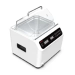 A white culinary vacuum sealer with a transparent lid and a digital display showing the status OFF and 245. It has control buttons on the front panel and cut-out handles on the sides.