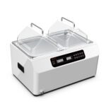 A white double-chamber laboratory water bath with transparent hinged lids. It features a digital control panel on the front displaying OFF and 24.5. The device has handles on the sides.