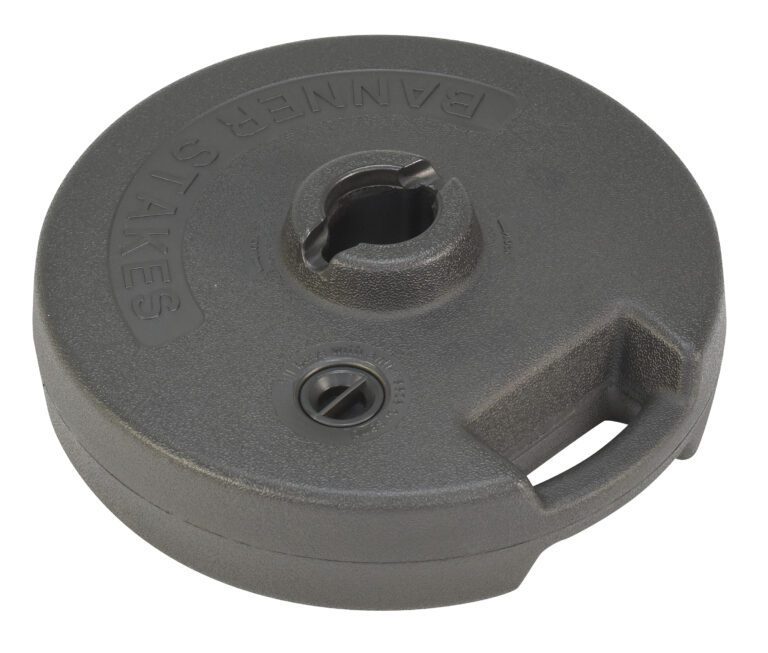 The Vestil Web Barrier Base includes a grey circular weight with an easy-grip handle and a central opening for poles. The word BANNER is embossed on its surface, offering both functionality and sleek design.