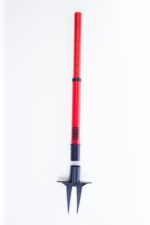 This Vestil Web Barrier Stake 42 in red is a gardening tool with a telescopic handle and retractable metal prongs, ideal for aerating soil. The segmented design allows adjustable length, set against a plain white background.