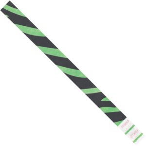 A close-up of the 3/4 x 10 Green Zebra Stripe Tyvek® wristband highlights its bold diagonal black and green stripes. It includes a white area for small text, ideal for ID or security. Sold in cases of 500, theyre great for events needing dependable wristbands.