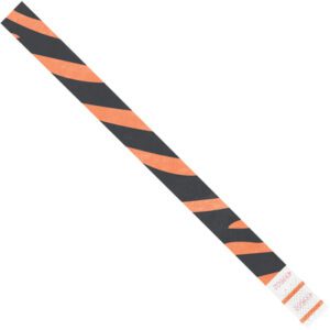 The 3/4 x 10 Orange Zebra Stripe Tyvek® wristbands feature a narrow strip with orange zebra design, and one end has a white section for text and barcodes, ideal for identification.