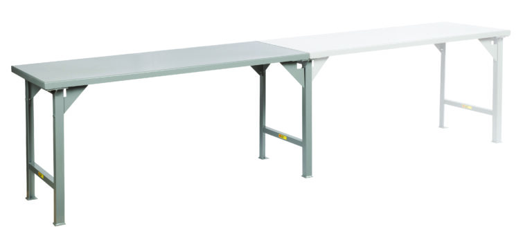 The Little Giant Continuous Width Production Tables boast a long, rectangular shape with gray and white segments supported by robust metal legs, offering a sleek side perspective against a white backdrop.