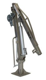 The Vestil Winch Truck Jib Crane 1K Extended Ss is a metallic lifting device with a pivot point, hydraulic cylinder, and gear mechanism. Mounted on a base featuring branding text, its designed for industrial and mechanical use.