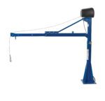 The Vestil AC Power Jib Crane has a 1.5K capacity and a 66-inch boom, featuring vertical support, horizontal arm, pulley with cable and hook for lifting heavy objects, secure base with black motor casing on top, all in blue metal construction built to CSA standards.