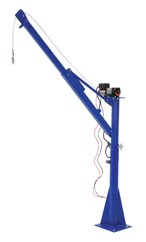 The Vestil DC Power Lift Jib Crane, with a 1.5K capacity and 66-inch boom, is blue and metal, mounted on a square base. It has a power unit connected by wires and an arm extending diagonally upward to the left.