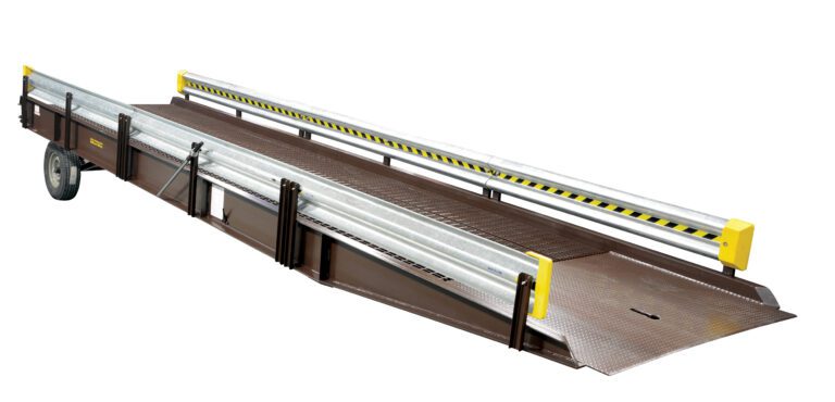 The Vestil Alum Yard Ramp Optional Guard Rail 30 Ft is a versatile portable loading dock ramp featuring a sturdy metal surface, brown finish with yellow and black safety stripes on the side rails, and optional guard rails. Equipped with wheels for easy mobility.