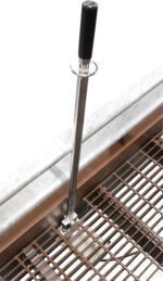 The Vestil Yard Ramp Option Pnu Tire & Manual Lift includes a vertical retractable stanchion with a black handle on a grated metal edge, enhancing crowd control or safety barriers, strategically placed at the platforms corner.