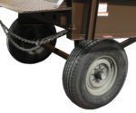 A close-up showcases a wheeled cart or trailer with a sturdy metal frame and two Vestil Yard Ramp Option Pnu Tires. Chains support the structure, while visible treads and the brand name on the tires highlight its manual lift, all set against a plain white background.