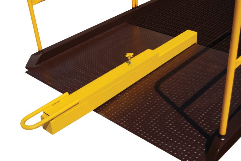 A secure yellow safety gate with a latch is set on a brown textured metal floor between two railings, enhancing industrial or worksite safety alongside the Vestil Yard Ramp Option Tow Bar 8 In Service H.