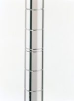 A tall, shiny metallic column with segmented cylindrical sections stacked on top of each other, against a white background.