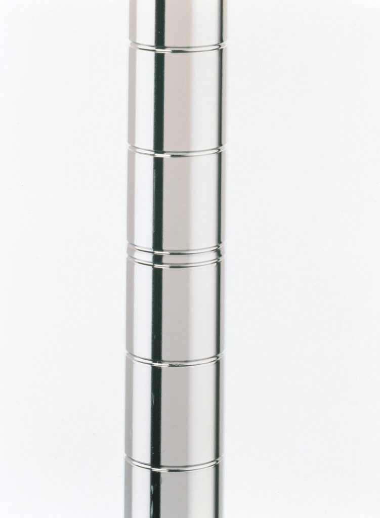 kdx17hqwt7toz6vx6scw4b0vg6xiw1pi.jpg A vertical stack of six grooved, shiny metal rings on a white background resembles a polished stainless steel finish, closely aligning and reflecting light like the sleek design of an 86 H Metro Super Erecta 86PS SiteSelect Industrial Wire Shelving Post.